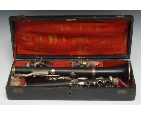 A 19th century rosewood clarinet, nickel plated mounts, 69cm long overall, fitted tooled morocco case with brass swan neck ha