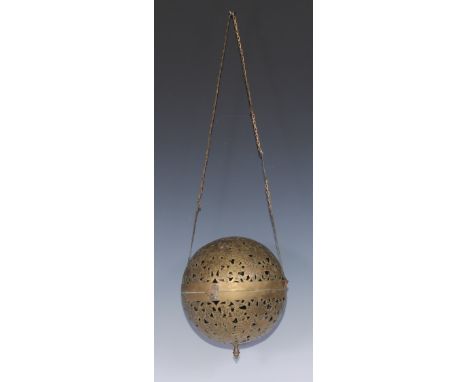 A large 19th century Indian/Middle Eastern rolling lamp or incense ball, pierced and engraved with birds amongst foliage, kno