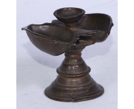 An Indian bronze lamp, lotus trumpet base, 8cm high, 19th century 