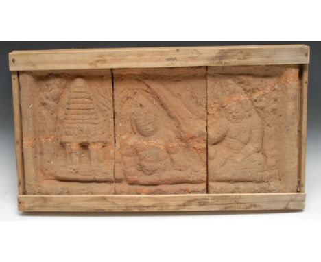 Antiquities - a Majapahit terracotta three-panel stele, in relief with temple and figures, 34cm high, 66cm wide overall, c.15