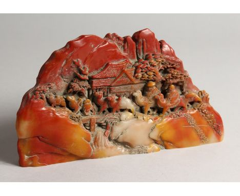 A CHINESE HARDSTONE CARVED BOULDER 9ins long