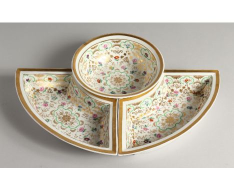 A K. P. M. PORCELAIN CIRCULAR BOWL with gilt decoration and painted with flowers. 7ins diameter and a pair of matching dishes