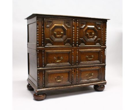 A GOOD LATE 17TH CENTURY LIGHT OAK TWO PIECE LINEN FOLD FRONT CHEST OF THREE DRAWERS, with replacement brass handles, on bun 
