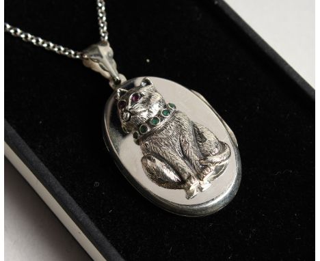 A SILVER CAT LOCKET set with ruby and emeralds