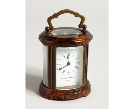 A GOOD CIRCULAR BRASS CARRIAGE CLOCK, MATTHEW NORMAN, LONDON. 3ins high