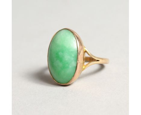 A GOLD AND JADE RING