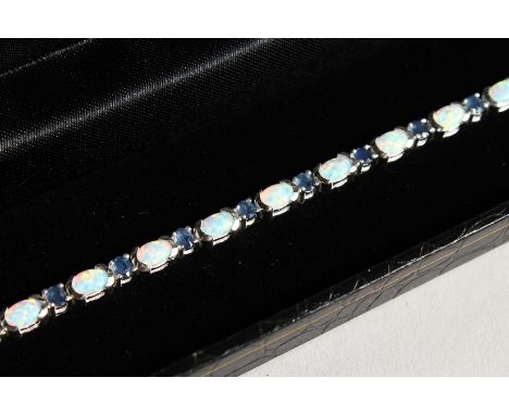 A SILVER OPAL AND SAPPHIRE LINE BRACELET