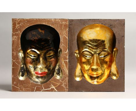 A PAIR OF CHINESE WOODEN PORTRAIT PICTURES with inset heads in gilt 12ins x 9.5ins