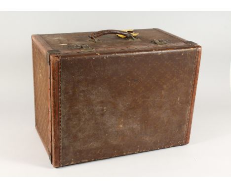 AN OLD LOUIS VUITTON STYLE LEATHER TRUNK with fitted interior and leather carrying handle. 1ft 9ins wide 1ft3ins deep x 1ft 3