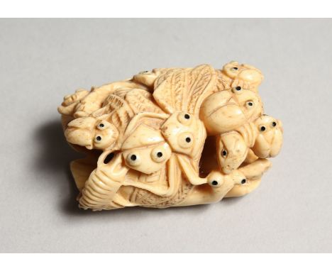 A CARVED BONE NETSUKE