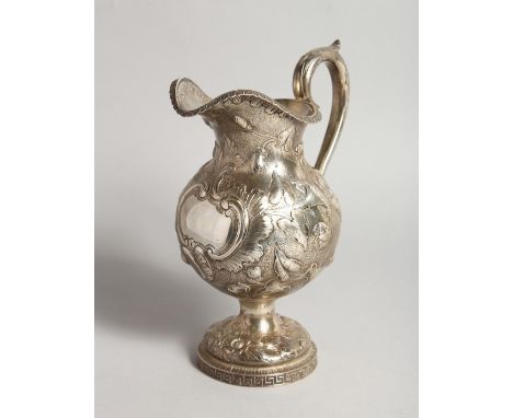 AN R &amp; W WILSON 19TH CENTURY PHILADELPHIA SILVER JUG repousse with flowers and scrolls 8ins high, weighs 10ozs.