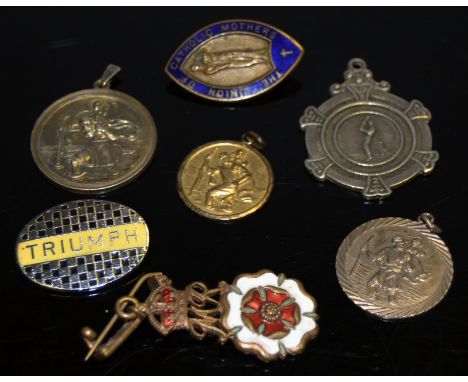 A silver St Christopher pendant; another; enamel badges; a cricket fob; a rolled gold St Christopher (7)