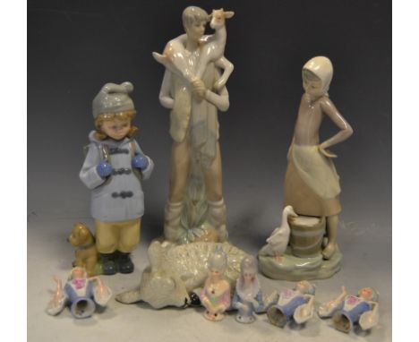 Ceramics - a Lladro figure of a Boy carrying a Goat; another of a Girl feeding a Duck; a Nao figure ; German half dolls;  etc
