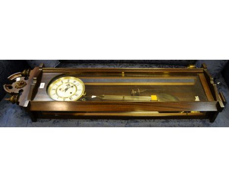 A Woodhouse Marketing (clocks)Ltd. drop pendulum  wall clock, enamel dial , twin winding holes