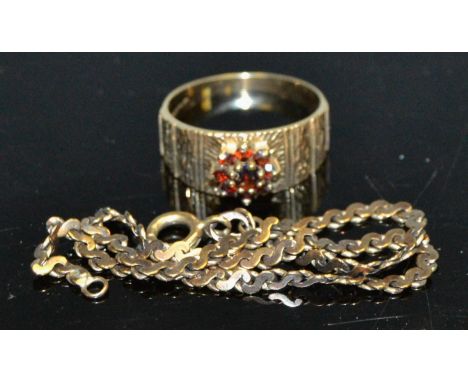 A 9ct gold and garnet ring; a bracelet market 9k (2)