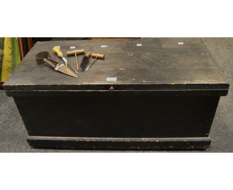 An early 20th century painted pitch pine tool chest, drop swing handles, enclosing various Victorian and later tools 