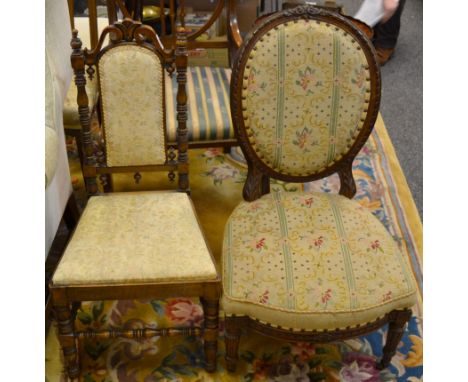 A 19th century walnut Nursing chair; another balloon back, profusely carved throughout, upholstered in tapestry in tones of g