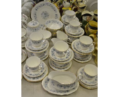 A Colclough china part tea service printed with blue floral sprigs