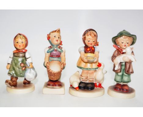 Four early Goebel Hummel girl and boy figures tallest approx 12cm