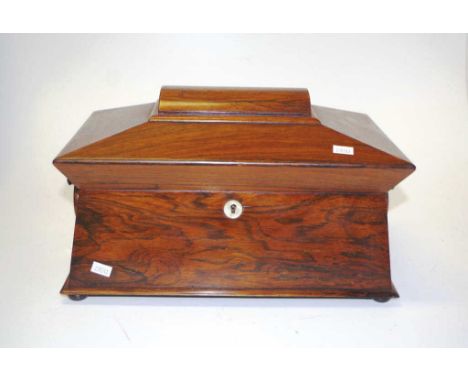 William IV rosewood tea caddy on four bun feet with internal triple fitted interior, vaulted canister to either side and fitt