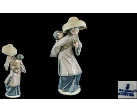Lladro Hand Painted Porcelain Figure ' My Precious Bundle ' Model No 5123. Issued 1982 - 1998. Height 10.25 Inches - 25.60 cm