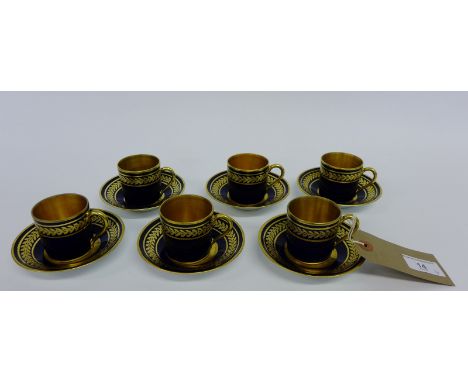 Bernardaud Limoges cobalt blue glazed coffee cans and saucers, each with gilded laurel leaf pattern (12) 