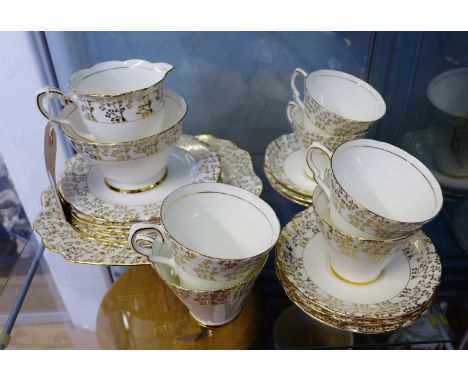 Gladstone bone china white glazed and gilded tea set for six to include six cups, six saucers, six side plates, cake plate, m