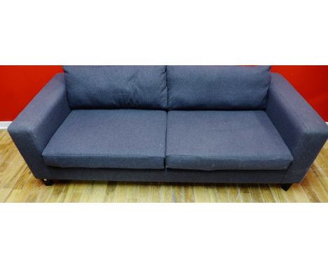 A contemporary three seater sofa upholstered in a grey wool fabric, raised on squared tapering supports