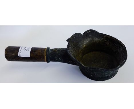 South East Asian bronze cooking pot, with Archaic pattern and turned wooden handle