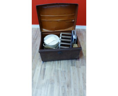 An early 20th century metal trunk containing a collection of vintage tools and pots, etc (a lot) 
