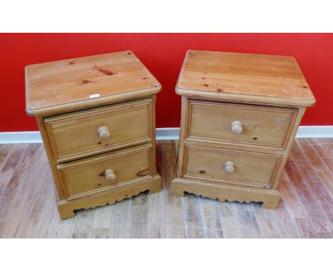 A pair of contemporary pine bedsides, each having two short drawers and raised on bracket feet, 56 x 65cm
