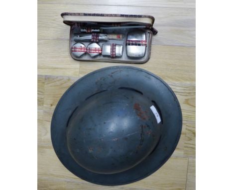 Army helmet and a travelling toiletry kit (2)