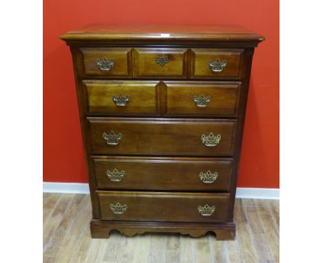 A contemporary hardwood chest of drawers having five graduating long drawers raised on bracket feet, 93 x 124cm