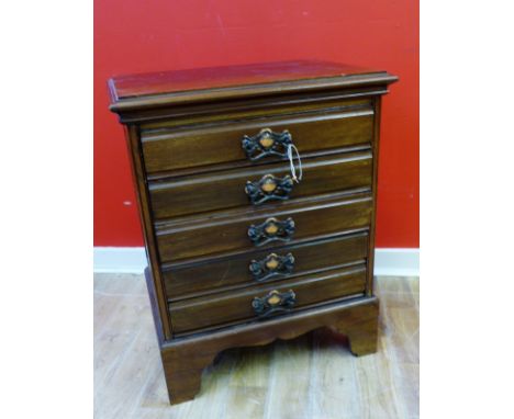 An Edwardian mahogany sheet music cabinet with a moulded top above five drawers raised on bracket feet, 50 x 64cm