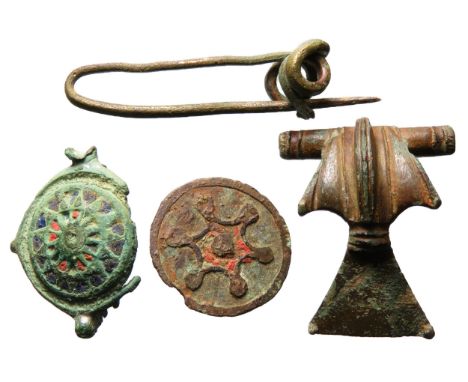 Roman and Celtic brooch group (4) to include an enamelled umbonate brooch, 2nd century AD, with pin. An enamelled disc brooch