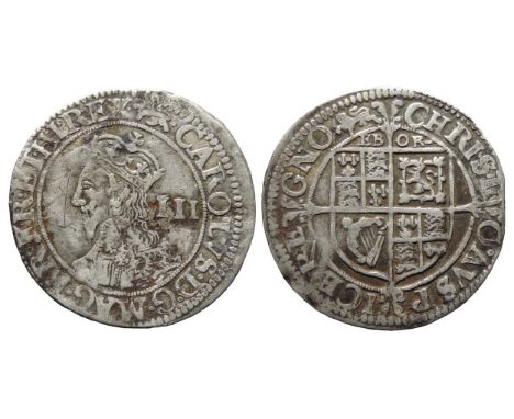 Charles I threepence, York, 1643-4. Crowned bust left, III mark of value behind, CAROLVS D G MAG BR FR ET HI REX. R. Shield o