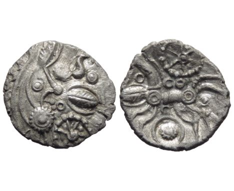 East Wiltshire Snake Head silver unit. Circa 50-35 BC. Moon head right, large boss chin, stalk lips, coffee bean motifs in fr