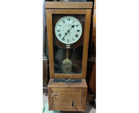 An early 20th century clocking-in clock in oak case, "The Gledhill-Brook Time Recorder Ltd" 