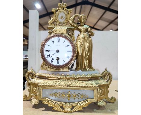 A 19th century French mantel clock in ornate gilt metal case depicting a female figure, with drum movement, height 32 cm 