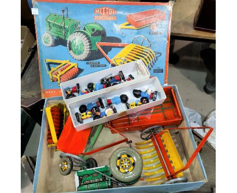 A 1960's/70's mechanical tractor set by Mettoy, in original box; a Robertson's 11 piece 'Golly' band 