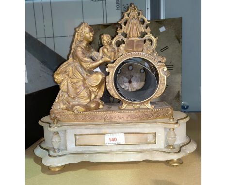 A 19th century French mantel clock case in ornate gilt metal and white marble, surmounted by a woman and child (no dial or mo