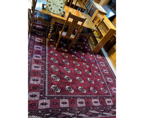 A modern large Bokhara carpet, hand knotted, with red ground, 425 x 248 cm 