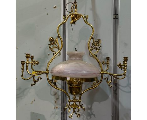 A Victorian style large ornate brass oil lamp/chandelier with 6 brass side sconces 