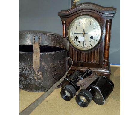 An Edwardian striking mantel clock in mahogany case; a reproduction carriage clock; a pair of binoculars 
