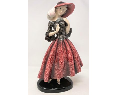 An Art Deco figure, Goldscheider, Wien, depicting a woman in hat and flowing dress, height 37 cm (very slight hairline to bas