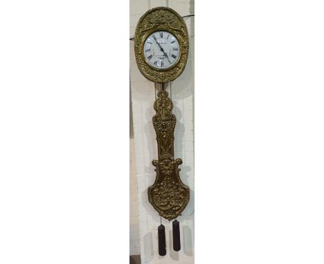 A 19th century French Comtoise wall clock  with white painted enamel dial and ornate embossed brass surround and pendulum, do