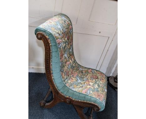A Victorian nursing chair, with scroll end frame and button back tapestry style upholstery (a/f)