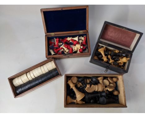 Three boxed chess sets to include an ivory and stained red Staunton type example, height of king 6.1cm, together with a boxed