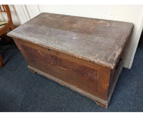 A 19th century stained pine trunk, the rectangular hinged top enclosing a candle box, on bracket feet, 95cm, and a stained wo