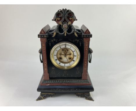 A 19th century Henri Marc of Paris black slate and red marble mantle clock, the circular dial with Roman numerals and visible